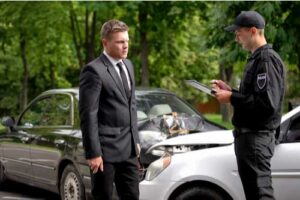 Officer making police report after car crash